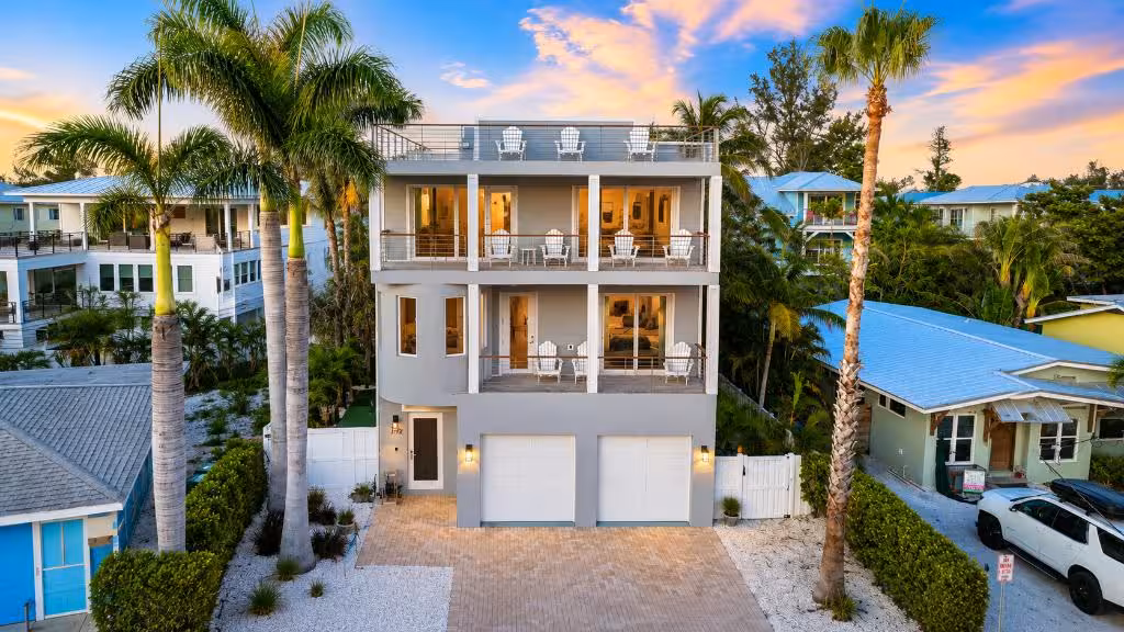 Shore to Please exterior and rooftop deck at sunset